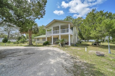 Set on 4.63 cleared acres along a paved county road, this unique - photo 1