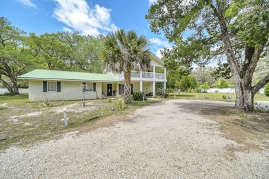 Set on 4.63 cleared acres along a paved county road, this unique - photo 2