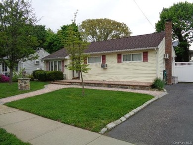 Well-maintained 3-bedroom, 2-bath expanded ranch featuring - photo 1