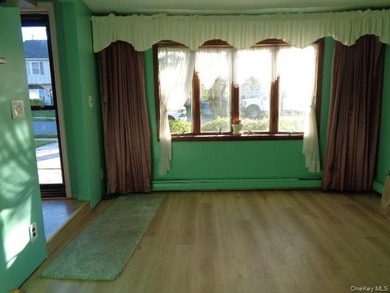 Well-maintained 3-bedroom, 2-bath expanded ranch featuring - photo 2