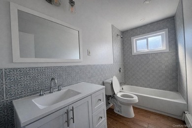 Spacious brick multifamily home offering three levels of living - photo 6