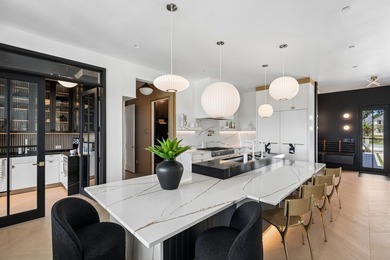 Modern coastal luxury awaits at 4017 Kaolin Street, a - photo 17