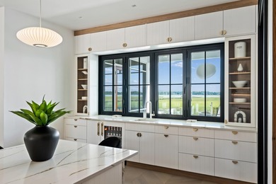 Modern coastal luxury awaits at 4017 Kaolin Street, a - photo 18