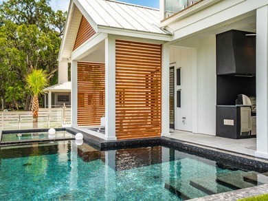 Modern coastal luxury awaits at 4017 Kaolin Street, a - photo 31