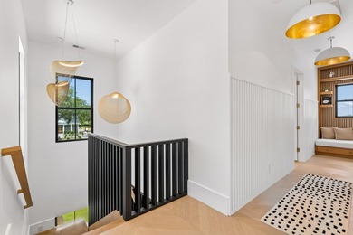 Modern coastal luxury awaits at 4017 Kaolin Street, a - photo 50