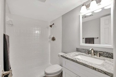 Beautifully remodeled ground floor unit in a gated 55 + - photo 11