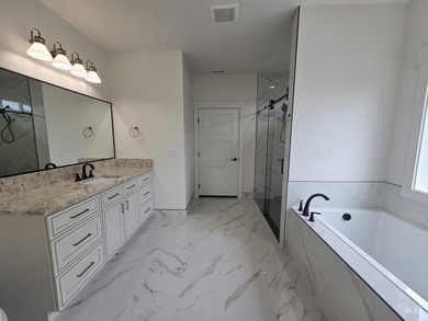 This beautifully designed one-level home offers 2,067 square