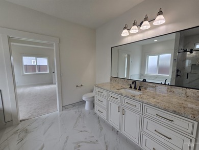 This beautifully designed one-level home offers 2,067 square