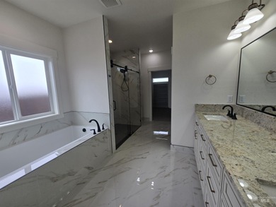 This beautifully designed one-level home offers 2,067 square