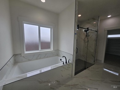 This beautifully designed one-level home offers 2,067 square