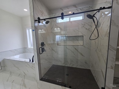 This beautifully designed one-level home offers 2,067 square