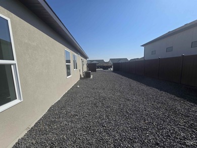 This beautifully designed one-level home offers 2,067 square