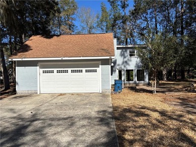 This comfortable cape/colonial home sits on a beautiful wooded - photo 46