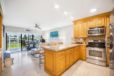 This charming ground-level 1-bedroom, 1-bathroom condo offers - photo 1